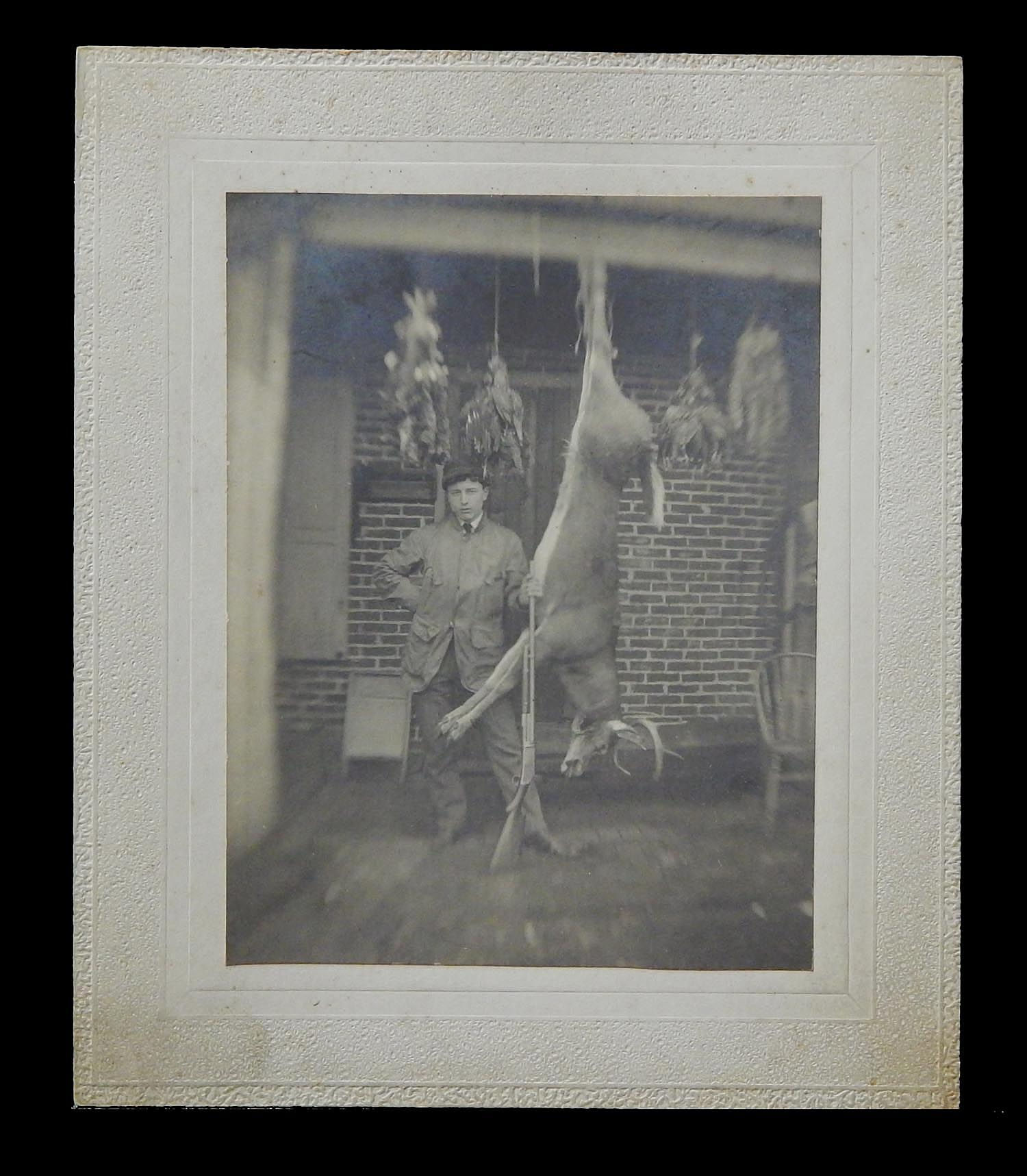c1900 Mounted Photo The Hunter outdoorsman armed with Rifle posing hanging Buck deer