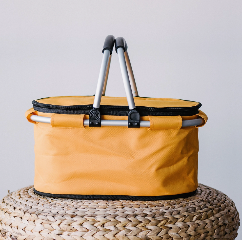 Thumbnail: Yellow picnic basket with black handles on woven wicker background.