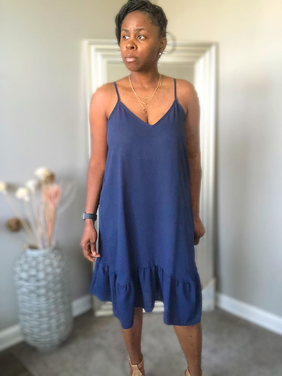 Thumbnail: Woman wearing blue dress posing in front of mirror indoors, smiling.