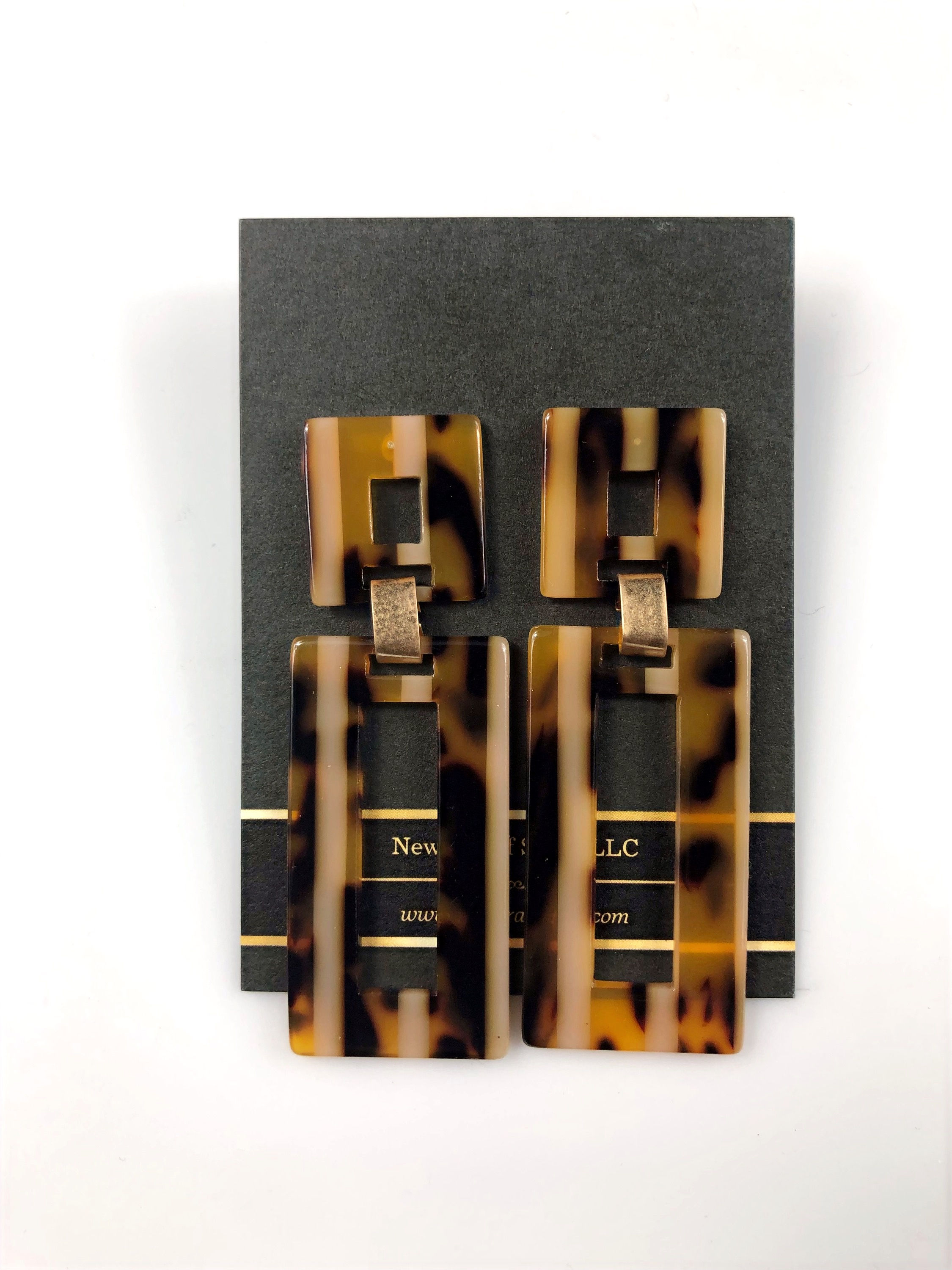 Tortoise shell earrings on display card with 'RENEE LEICHT' branding