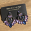 Thumbnail: Pair of New Era of Style earrings with blue and purple gems.
