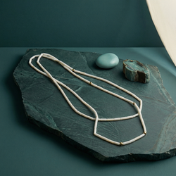 Minimalist white mother of pearl tube necklace with gold bead accents. MHL Jewelry Designs handcrafted danty long strand.