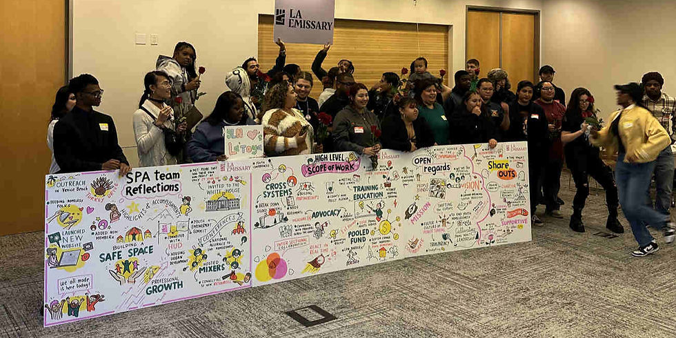 Group of people posing with illustrated reflection board at an indoor event