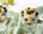 Individual Key Lime Pie Trifles with layers of cake, key lime pie filling and blueberries.