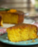 Slice of olive oil cake with orange and rosemary syrup