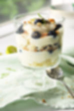 Individual Key Lime Pie Trifles with layers of cake, key lime pie filling and blueberries.