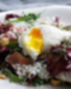 Grilled Radicchio Salad with hazelnuts and Pecorino Romano cheese, prosciutto and a softly poaced egg