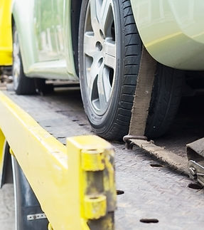 car-transporter-breakdown-lorry-working-using-locked-belt-transport-other-green-car.jpg