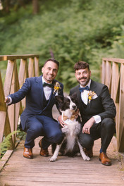 Mark and Graham pose for a photo with their dog