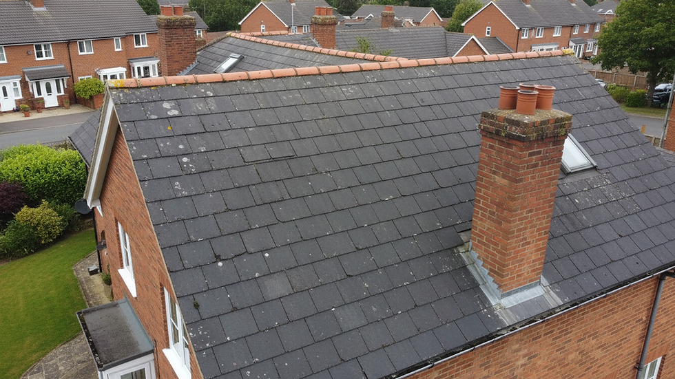 High angle view of a roof with asphalt shingles showing minor wear