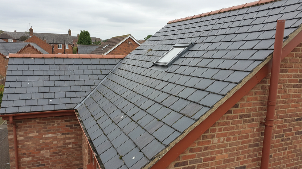 High angle view of a roof with visible shingles and gutters