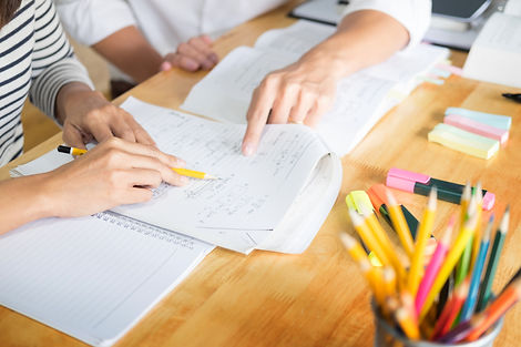 woman learn and teach tutor concept education helping each other sitting in a table at cl