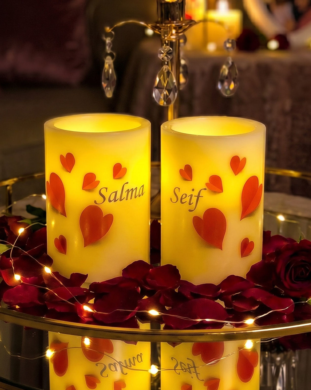 Falling Hearts personalized flameless LED candle set of two, round S10 candles with scattered red hearts and names glowing at
