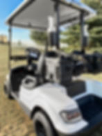 Side profile of Cooler Caddie mount installed on an Icon golf cart holding a Yeti cooler.