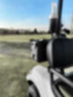 A Cooler Caddie mount installed on an Icon golf cart holding an Rtic cooler.
