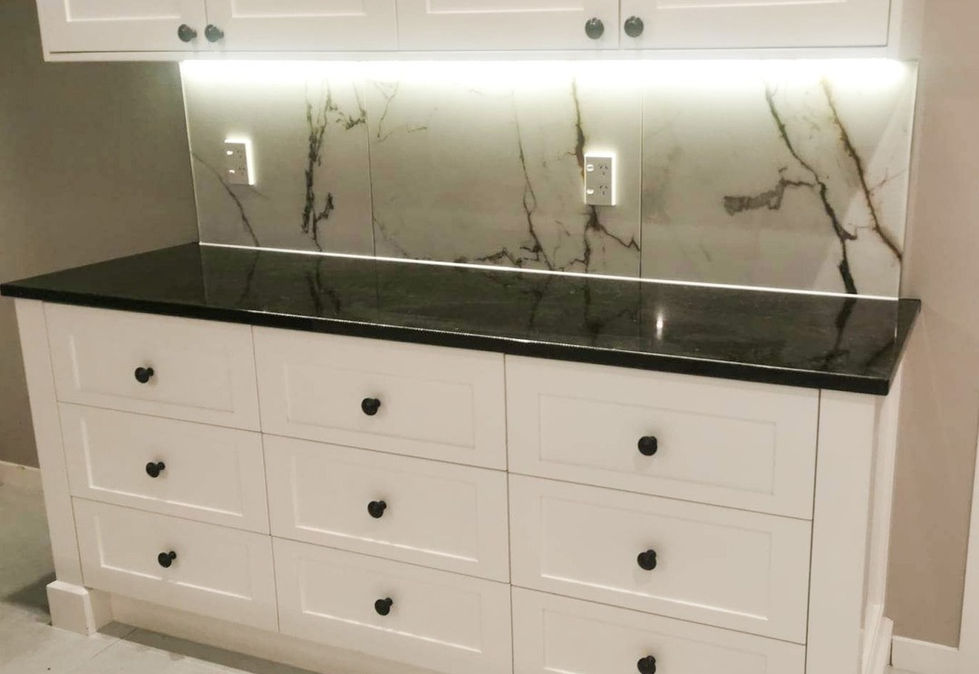 Elegant floor tiling seamlessly complemented by kitchen splashbacks and benchtop side tiling, elevating the overall aesthetic of the space.