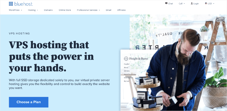 Bluehost ad with blue background highlights VPS hosting. A man packs gift boxes in a cozy, plant-filled setting. Choose a Plan button.