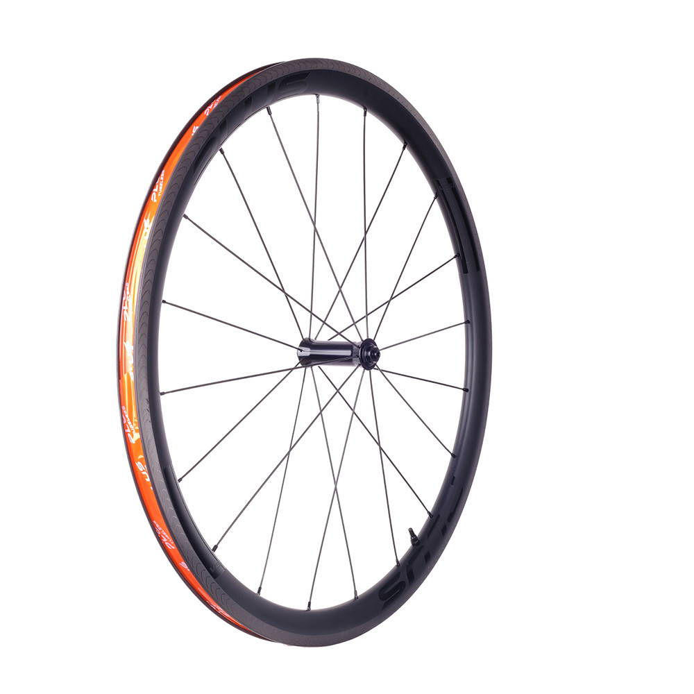 Bicycle wheel with black rim and orange accents.