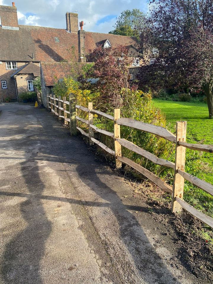 Wooden fence in front of a house on a sunny day, Home