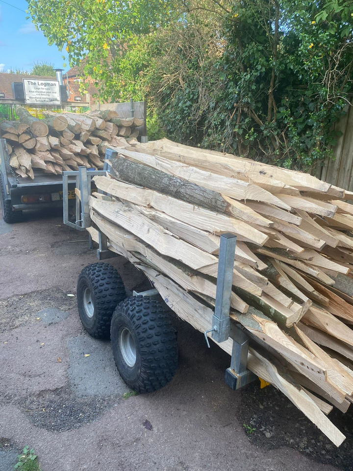 Trailer loaded with wood planks, ready for transport to a destination