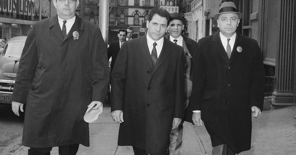 John “Sonny” Franzese, center, is escorted to the Elizabeth Street police station in New York after his arrest on a 43-count gambling indictment.