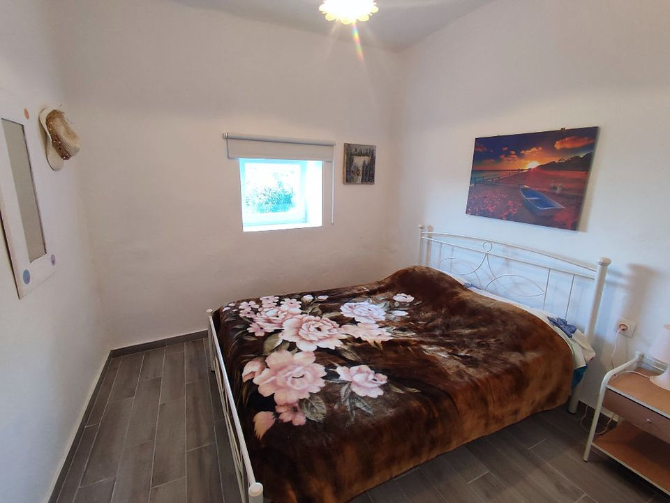 Bedroom 2 of Lorentzia House 2 in Andros, Greece.