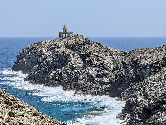 Lighthouse on Papargyros Cape, Tinos, Greece.