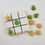 Thumbnail: Tic Tac Dough cookie game with iced grid cookie and green tree and gold star cookie pieces.
