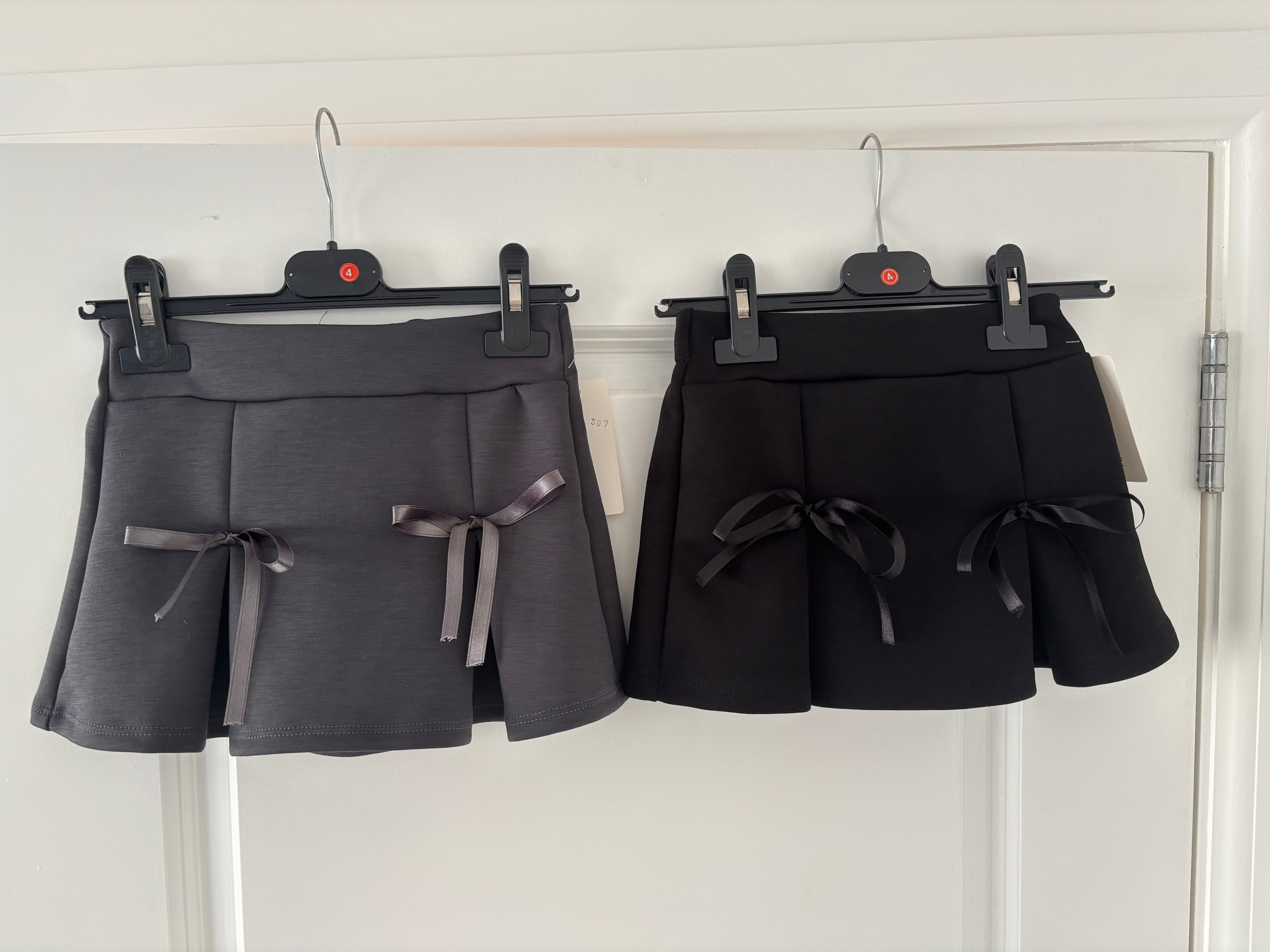 Black school skirts with bows 