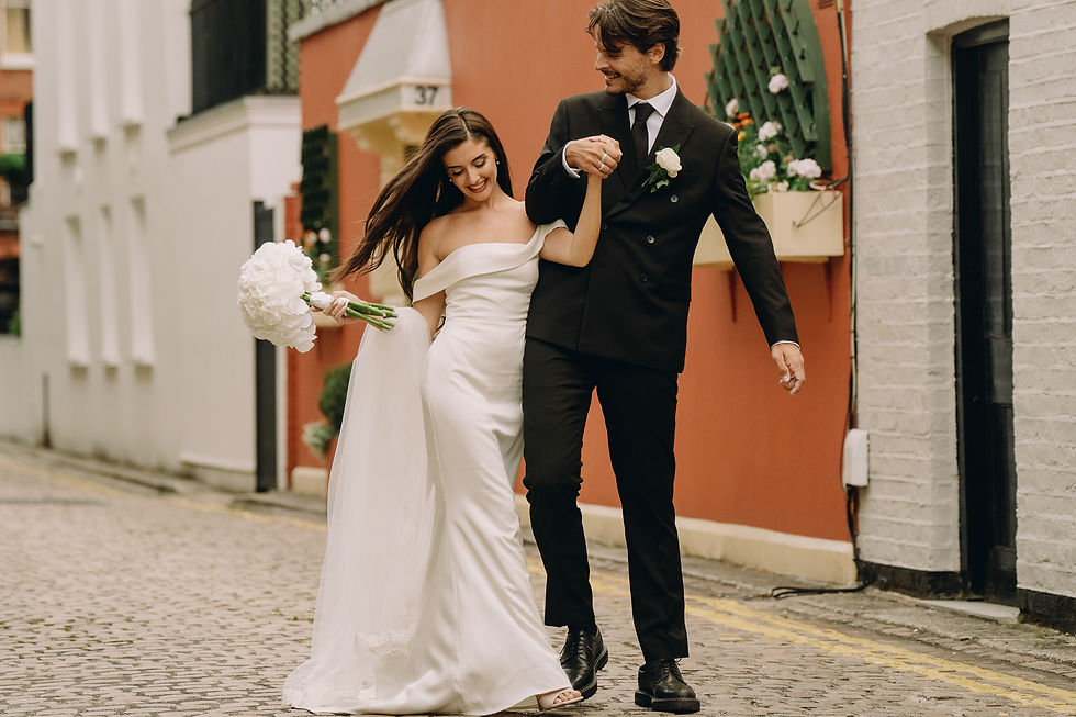 A wedding couple in Kensington walking together in a nearby mews