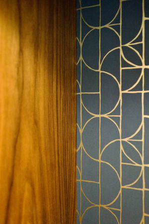 Walnut built-in cabinetry finished with Rubio Monocoat Pure pairs beautifully with Hygge and West gold/blue wallpaper