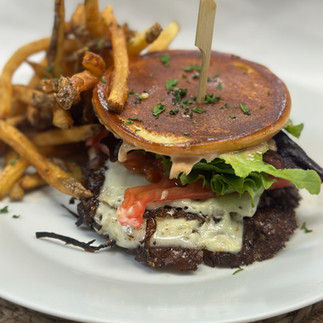 Smash burger with fries at Sugar Water in the Washington Hotel