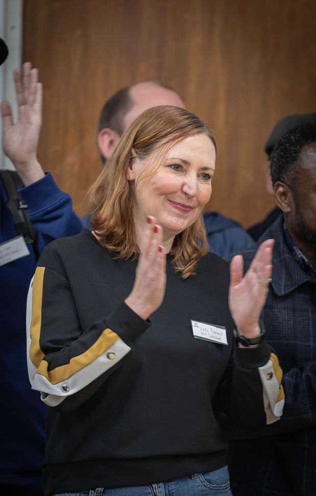 Smiling woman clapping