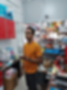 Man inside a spare parts and repair inventory room at TechGuru Assam, surrounded by neatly arranged tools and boxes.
