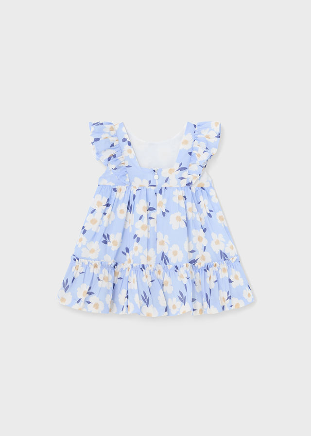 Blau-weißes Top mit Blumenmuster und Rüschenärmeln für Kinder.