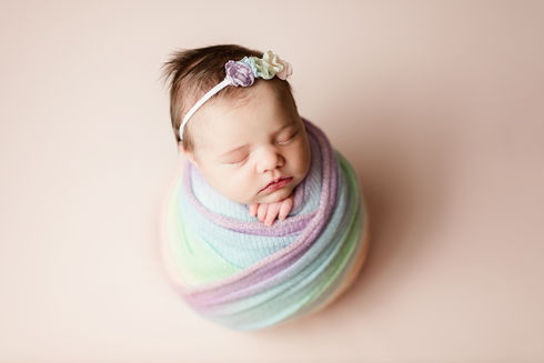 rainbow newborn session with rainbow wrap