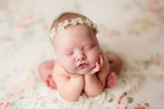 newborn session froggy pose on floral drop