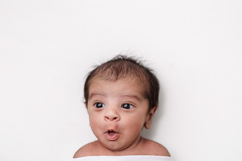 newborn baby boy expressions portrait while yawning 