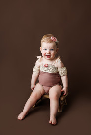 noblesville child photographer, fishers child photographer, child photographer near me, milestone photographer, milestone photography on brown background in boho chair