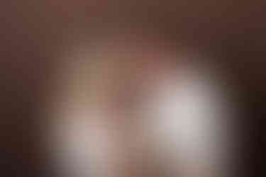 family newborn photography on brown background