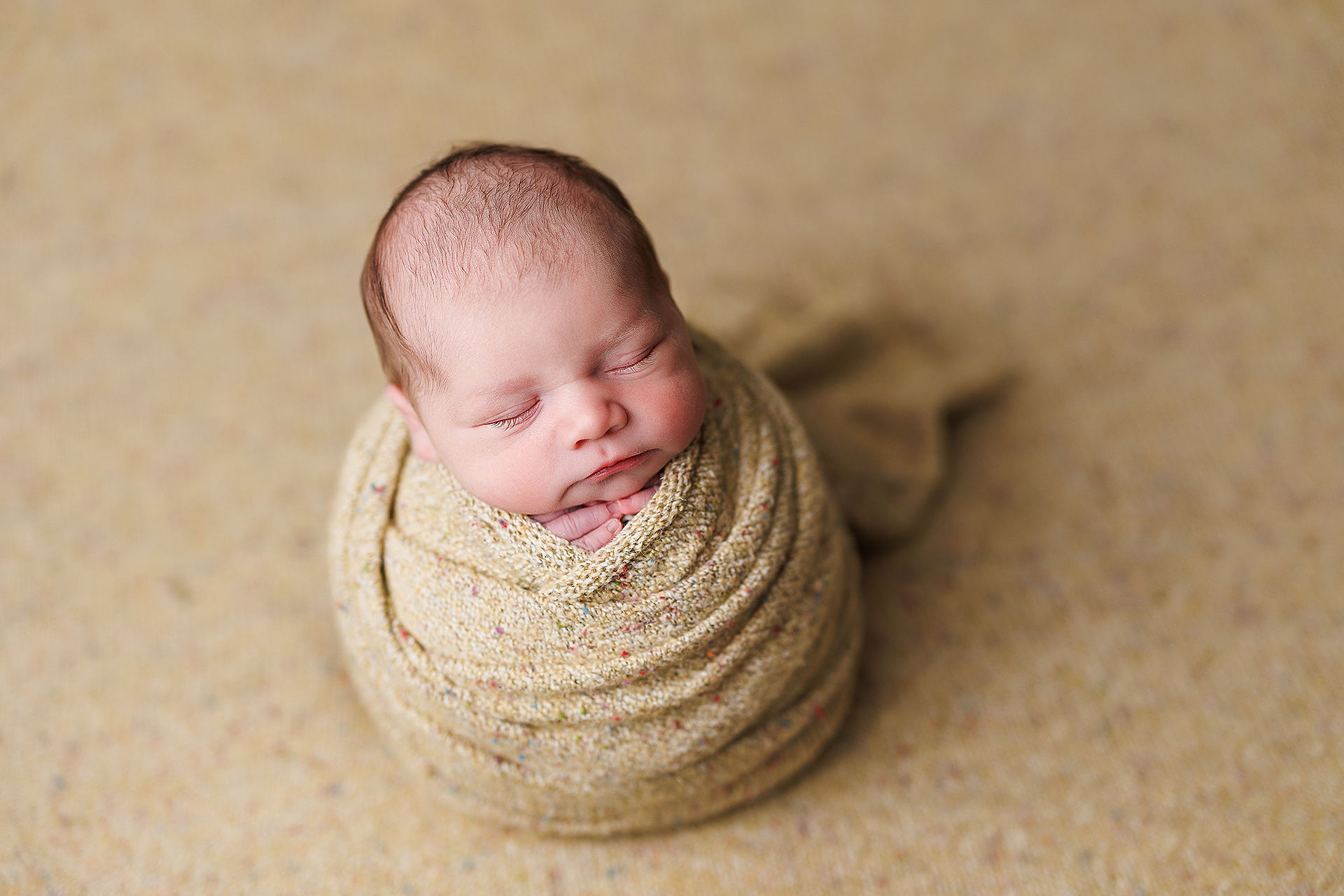 newborn posing, newborn session, newborn photography, potato sack pose, newborn wrapped poses, newborn photographer near me, newborn boy on yellow, newborn boy on blue