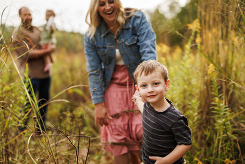 golden hour sunset family session in autumn wildflower field