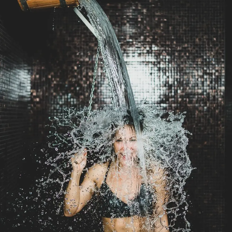 woman-taking-a-cold-shower-from-ice-bucket-2022-12-22-20-05-54-utc-1-scaled.webp