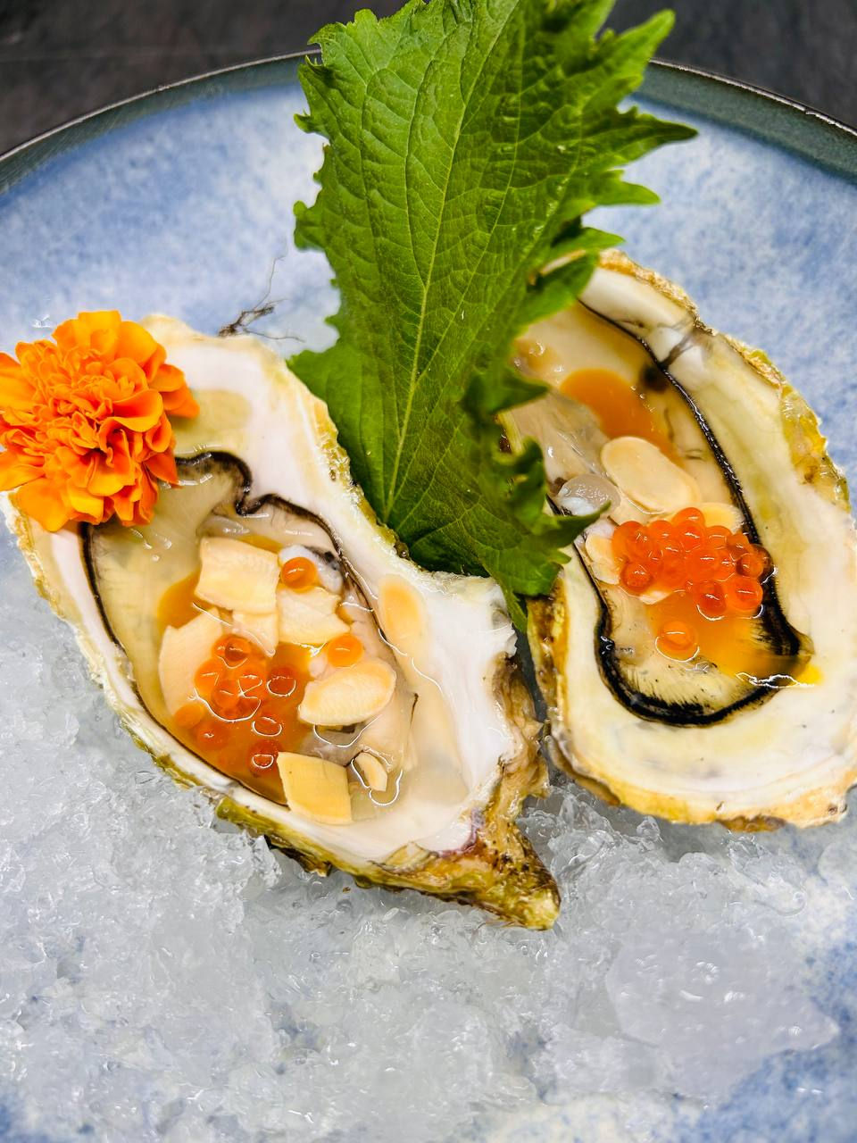 Oyster, sauce, passion fruit, almonds, ikura, (gluten free) image
