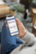 mockup-featuring-an-iphone-xs-being-held-by-a-woman-sitting-down-25356 (1).png