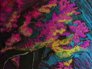 Bright pink glitter tree standing out against a teal background