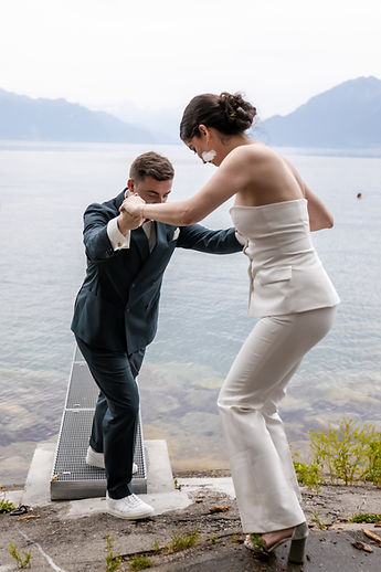 The couple playing on a jetty