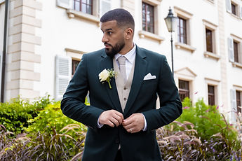 Marouan buttons his jacket