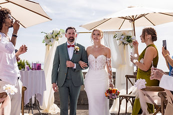 The couple in the aisle, photographed by their guests