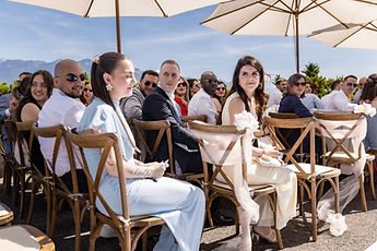 Guests wait beneath the parasols